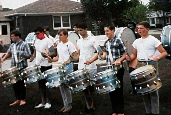 Queensmen drumline: Kip Dorn, Fred Saldana, Tim Stubbs, Joe Gallo, Jim Prewo, Tim Kratowicz. Back row: Tim Madison, Al Gomez, Jesse Foster.