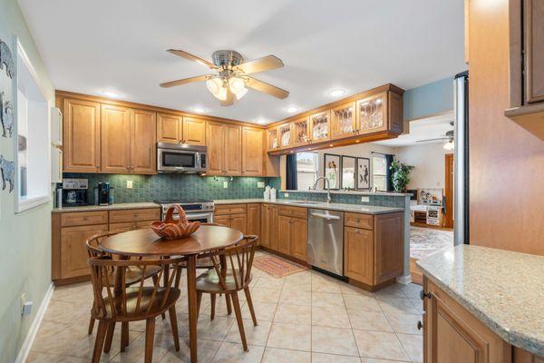 "The heart of the home, beautifully photographed. Check out this stunning kitchen that's perfect for any culinary enthusiast.