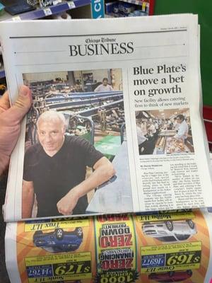 The owner on the cover of the Chicago Tribune for printing the Blackhawks' Championship Shirts