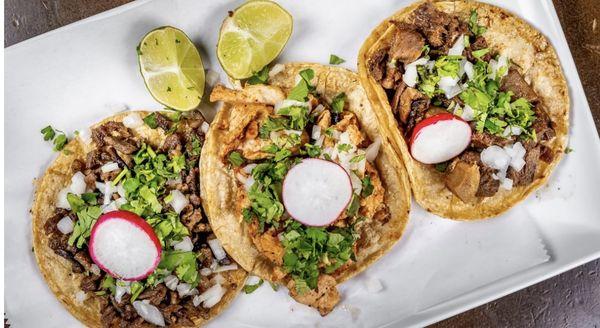 Variety of our street style tacos topped with either our tradition onions and cilantro or deluxe cheese, lettuce, sour cream.