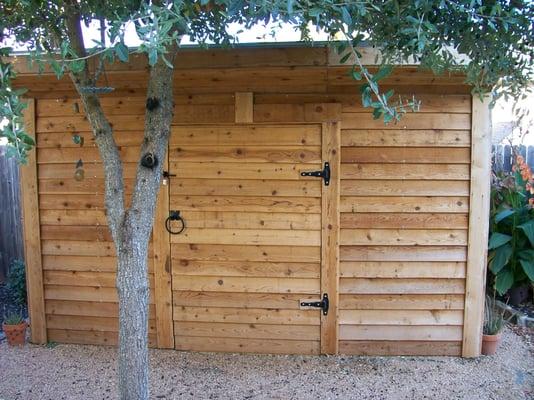 Back yard, custom built storage / work shed.