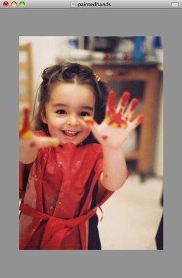 Painting during arts and crafts in the toddler class at Poppyseed.