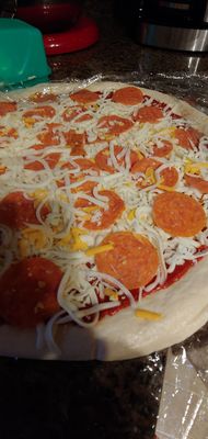 That is considered extra cheese, that I was charged for. It was all supposed to be on top of the pepperoni. Try following instructions .