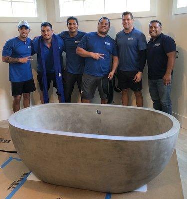 Stronger Moving and the 900 lb concrete tub moved into the master bath with no damage to tub, doors or finished walls.