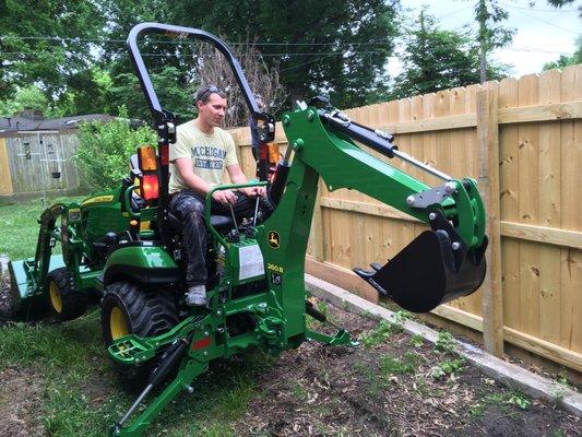 I can dig trenches.  My tractor backhoe is small enough to fit into most residential back yards.