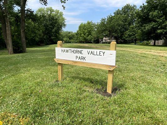 Park Sign Facing Roe Ave and Open Area