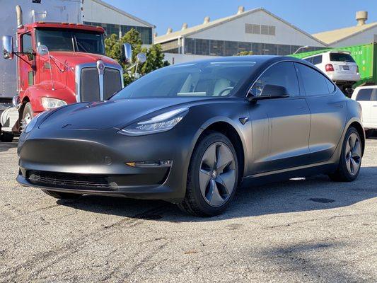 Satin black wrapped tesla