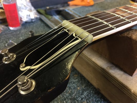 A great upgrade to any guitar is a bone nut, which can help with tone and sustain, and tuning stability when cut for your string gauge.