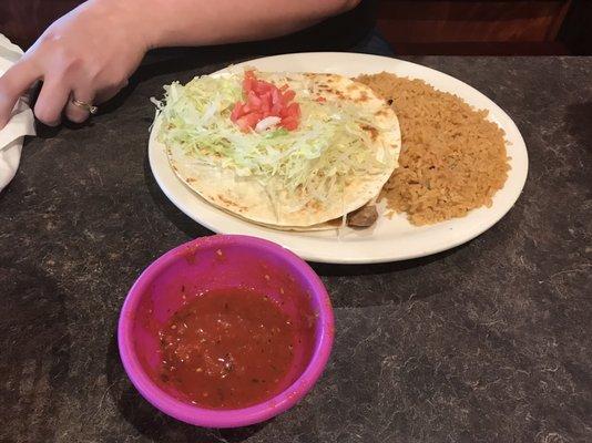 Quesadilla with chunky beef inside cheese etc... served with rice.