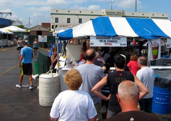 The Missionary Sisters of St. Charles Borromeo seem to have the busiest stand every year for their sfingi.