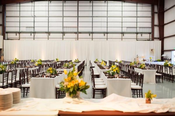 gorgeous rows of elegant seating with backlit pipe and drape