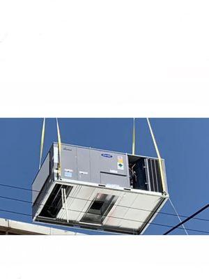 ROOFTOP HVAC PACKAGE UNIT BEING RIGGED INTO PLACE ONTOP OF  STEEL WORK