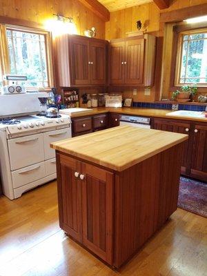 Redwood cabinets, maple butcher block island