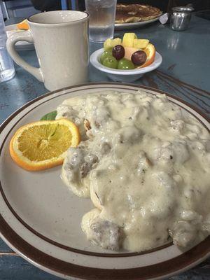 Biscuits and gravy with side of fruit. Yum!