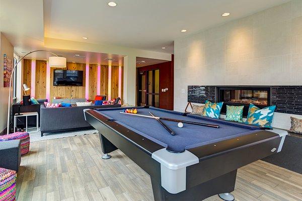 Resident lounge features billiards and fireplace