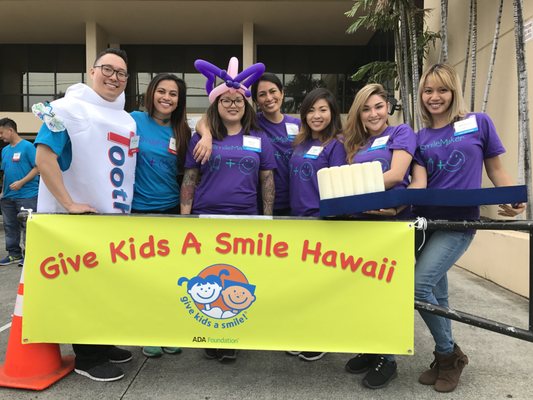 Our team providing free cleanings to children at the Give Kids a Smile Hawaii event held annually in February