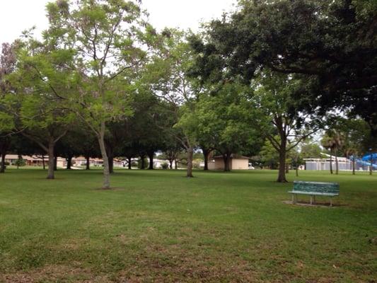 Some shady grassy areas. Next to a busy street so not very serene.