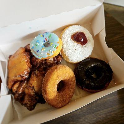 Apple Fritters, Cinnamon cake donut, chocolate cake donut, jelly donut, and blueberry yeast donut.