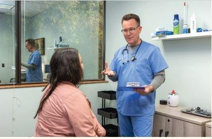 Dr. Hiller discussing care with a patient