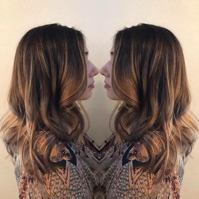 Golden balayage highlights with textured haircut