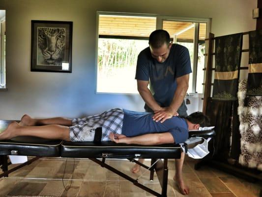 Dr. Pete providing an adjustment to his patient, helping that patient's body to heal.