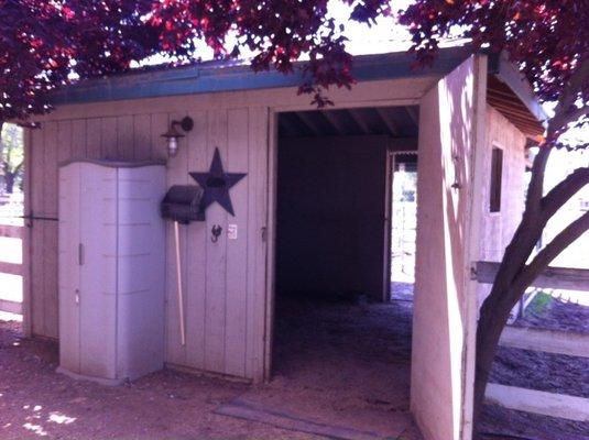 Individual horse stall / barn attached to paddock.