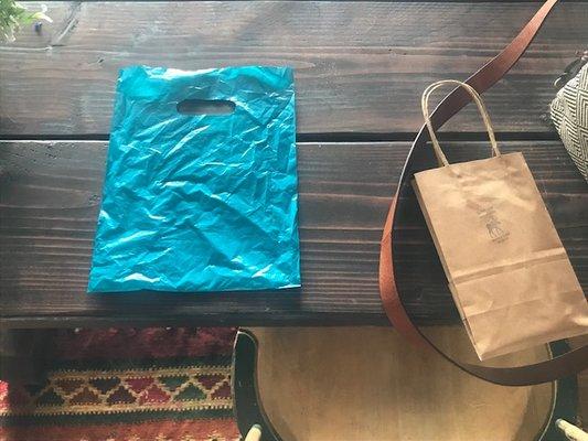 If you are a person of color,  you may be given the plain generic blue plastic bag vs the Rustic Moose's brown gift bag...