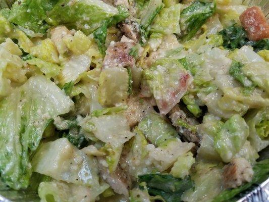 Chicken Ceasar Salad drenched in dressing!