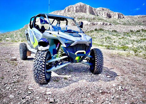 One of our RZR's in front of Boulder Hill