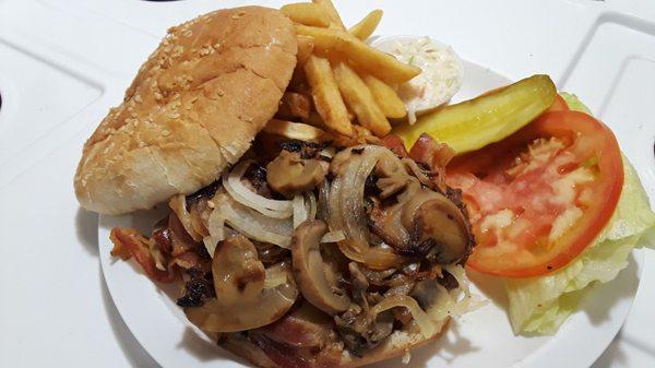 Charlie's Super Deluxe Burger: Swiss cheese, bacon, mushrooms, caramelized onions, served with lettuce, tomato, coleslaw, pickle, fries