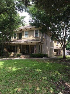 Front of main house and back apartments.