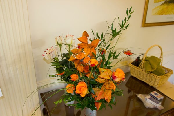 orange floral arrangement by Lilium. Roses and Orange Chinese Lantern flowers.