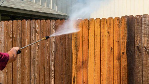 Fence being Pressure Washed