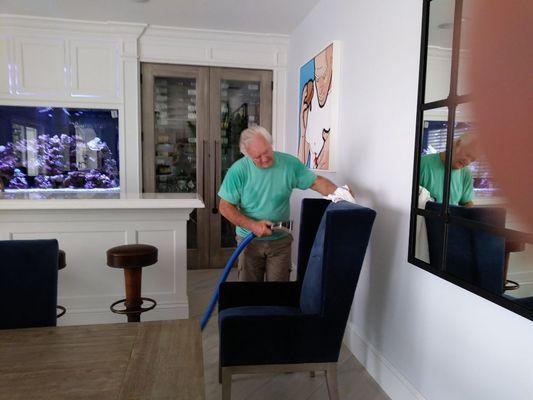 Rick cleaning a chair