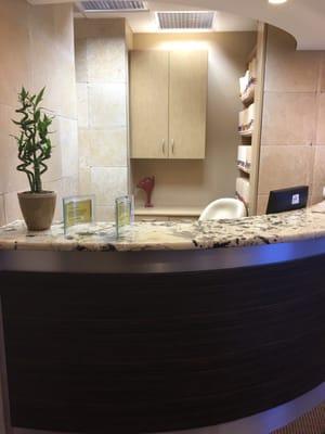 Dental office cabinetry and custom reception desk.