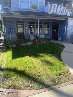 The green pasture shows an informal overflow parking space that can be utilized, if the rest of the  lot is if full.