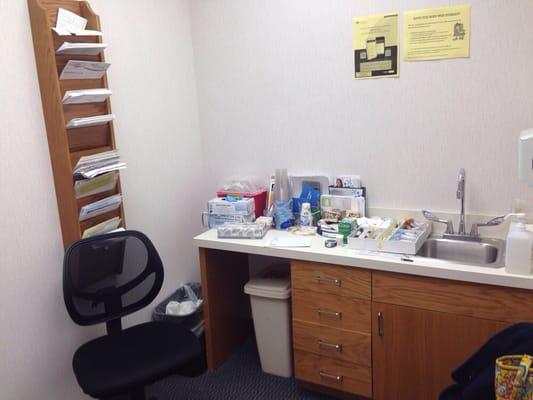 Exam room with supplies thrown on the counter