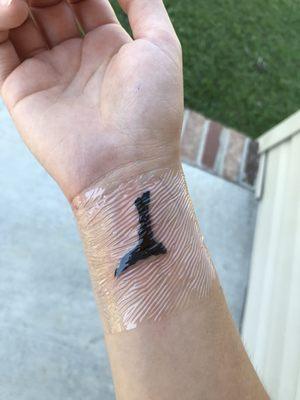 Backwards "L" marking that my 18 1/2 year old dog had with his ashes mixed into the ink.