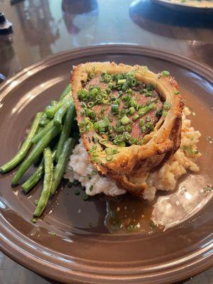 Beef, Wellington. It was fabulous. A fillet covered in flaky pastry with a side of risotto and green beans.