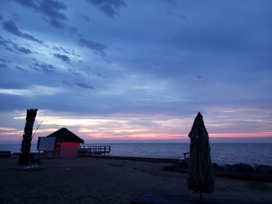 Start of sunrise standing near pier