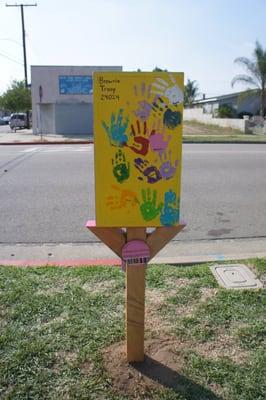 Hand prints done by Girl Scout Brownie Troop 24024 for the Little Free Library in Azusa.