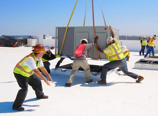 COAC Roof Crew Landing New Unit onto Roof of Central Valley Distribution Center.