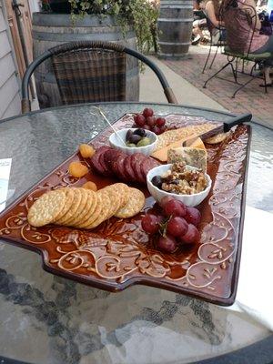 Cheese chocolate walnuts grapes sausage olive platter DELICIOUS