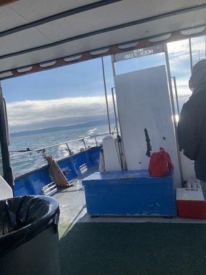 Looking out the back of the boat from inside the cabin