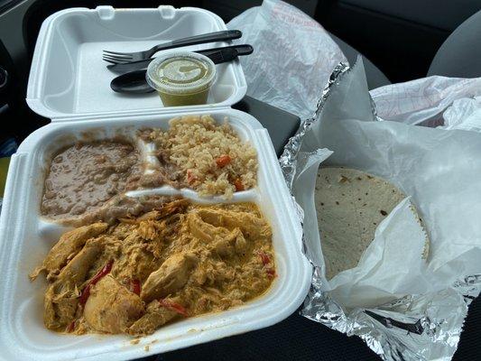 Choripollo with rice, beans, tortillas and salsa verde.