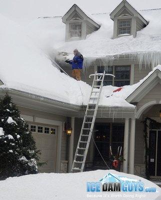 Removing two stories of ice dams in Chicago in February 2021.