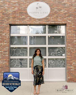 Model standing outside storefront