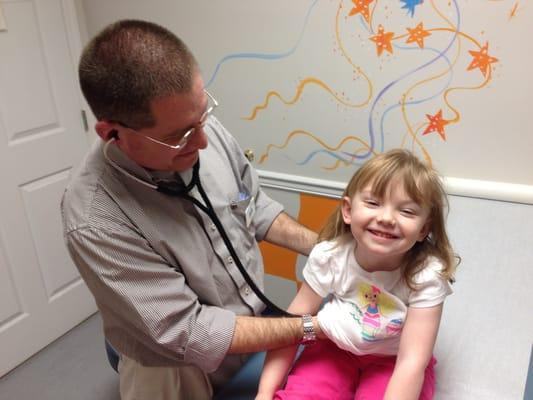 Dr. Perry at Children's Faith Pediatrics gives this little girl a checkup.