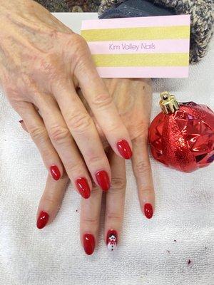 Manicure gel polish with design snowman.