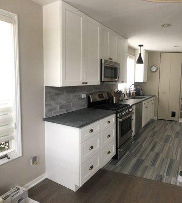 Post-renovation kitchen ... cabinets to the left of stove are additions.